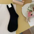 Black solid color ribbed warm mid-calf winter socks for women thick cozy knit daily wear style. - One Size / Black