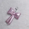Pink puffy bow keychain bag charm, shiny metallic fabric cute accessory for keys or bags. - Pink PU