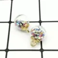 DIY glass ball pendant with colorful star sequins and gold alloy loop for handmade jewelry making. - Colorful