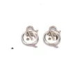 Primer plano de abalorio botón de aleación dorada con diseño de hilo de tejer para joyas DIY. - Botón / 19x12mm / Dorado