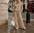 Detail view of casual beige half-zip hoodie and wide-leg sweatpants set street view - Tan