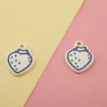 Close-up of white and blue strawberry alloy charms, perfect for DIY jewelry and keychains. - 10# Blue Line Strawberry
