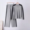Detailed view of the gray and black color-blocked knit sweater and wide-leg trousers set. - One Size / Top And Bottom / Gray