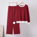 Close-up detail of women's red and white color block knit sweater and wide leg pants set. - One Size / Top And Bottom / Red