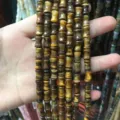 Detail view of 8x12mm tiger eye natural stone bamboo-shaped beads for DIY jewelry - 8*12mm (Approx. 32 Pieces/Strand) / Tiger's Eye