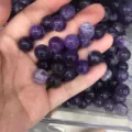 Macro view of high quality natural purple amethyst round loose beads held in hand for DIY jewelry - 6mm (No Hole) / Purple Crystal