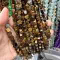 Detailed close-up showing 8mm star-shaped tiger eye stone beads for DIY jewelry making - 8mm (Approx 56 Beads Per Strand) / Tiger Eye