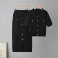 Black knit two-piece set detail, polo collar short sleeve top and midi skirt with gold buttons. - One Size / Black