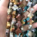 Macro detail showing the natural texture of multi-color clover stone beads for DIY jewelry - 14x14x5mm (Approx 28 Units) / Crazy Agate