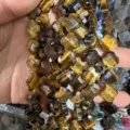 Detailed view of 12mm natural faceted tiger eye stone clover beads for DIY jewelry making - Tiger's Eye