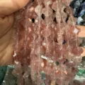 Detailed macro view of 12mm faceted four-leaf clover pink natural stone beads for DIY - Strawberry Quartz