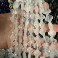 Detailed view of 12mm clear faceted clover natural stone beads for DIY jewelry - Approx 17 Pieces Per Strand / White Crystal