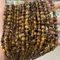 Close-up detail of 8mm star shaped natural tiger eye stone beads for DIY jewelry - 8mm (Approx. 55 Pieces/Strand) / Tiger's Eye