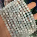 Cuentas redondas talladas de piedra natural azul claro de 6 mm para hacer joyas DIY - Aprox. 62 Cuentas/Tira / 6mm / Aguamarina