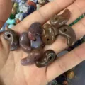 Macro view of assorted natural agate stone comma pendants for DIY jewelry making - 1 Piece (13*23mm) / India Agate