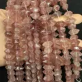 Close-up of pink hexagonal natural stone beads for DIY jewelry making - 7x14mm (Approx. 24 Pieces/Strand) / Strawberry Quartz