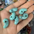 Close-up view of turquoise comma-shaped stone beads for DIY jewelry necklace making - 1 Piece (13*23mm) / Turquoise Pattern