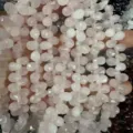 Primer plano de cuentas de piedra natural facetadas en forma de gota para creación de joyería - 6x9mm (44 Piezas/Tira) / Cuarzo rosa