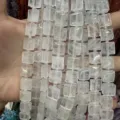 Macro detail of white quartz square beads with side grooves for DIY jewelry making. - 10*10*5mm (Approx 32 Beads Per Strand) / White Crystal