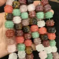 Detailed view of natural stone drum-shaped beads in various colors for DIY jewelry making - Multicolor