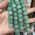 Detailed view of green natural stone drum-shaped carved beads for DIY jewelry design - Green Aventurine