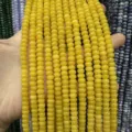 Macro detail of 4x6mm vibrant yellow abacus jade stone beads for DIY jewelry accessories - 90 Pieces/Pack / Optimized Topaz
