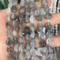 Gros plan de perles en pierre naturelle marbrée grise pour accessoires de bijoux DIY - 8*10mm (env. 39 pièces/brin) / Cristal Noir