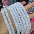 Close-up of 5x8mm faceted abacus opalescent loose stone beads for DIY jewelry - Approx. 70 Pcs/Strand / Milky White (42)
