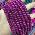 Close-up detail showing 5x8mm faceted magenta natural stone abacus beads for DIY jewelry - Approx. 70 Pcs/Strand / Rose Red (48)