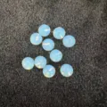 Light blue translucent semi-drilled round beads for DIY jewelry making and craft projects. - 6mm (No Hole) / Opalite
