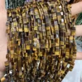 Detail view of 5x5mm double-hole tiger eye stone flat beads showing natural texture - 3x5mm (About 130 Pieces/Pack) / Natural Tiger Eye