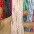 Close-up of 2mm pink round shell beads showing smooth texture and pearlescent luster. - 2mm (Approx. 38mm Strand) / Light Pink