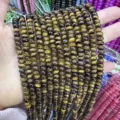 Macro view of 4x6mm natural tiger eye stone abacus beads with distinct chatoyancy - Abacus Bead Style / 4*6mm (Approx. 90 Pieces/Pack) / Tiger Eye