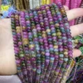 Close-up of 4x6mm multi-color natural stone abacus beads for DIY jewelry making. - 90 Pieces/Pack / Optimized Tourmaline