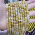 Macro detail of natural yellow stone rondelle beads 4x6mm for DIY jewelry making - 4*6mm (Approx. 90 Pcs/Strand) / Natural Yellow Jade