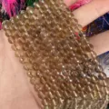 Cuentas de ágata marrón natural facetadas de 6 mm para la creación de joyas de bricolaje - Aprox. 62 Cuentas/Tira / 6mm / Cuarzo Ahumado Claro