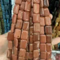 Detailed macro view of glittering gold sandstone rectangular loose beads for DIY jewelry crafts - 10*14mm*5mm (Approx 28 Pcs/Strand) / Gold Sandstone