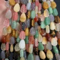 Close-up of multi-colored leaf-shaped natural stone beads for DIY jewelry making - 10x14x6 (15 Beads Per Strand) / Multicolor