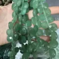 Close-up of faceted green natural stone heart-shaped beads for jewelry making - Heart / 13x13x6mm (Approx 27 Pcs/Strand) / Green Aventurine