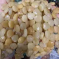 Detailed macro view of faceted creamy yellow natural stone teardrop beads for DIY jewelry making - Heart / 13x13x6mm (Approx 27 Pcs/Strand) / Natural Yellow Jade