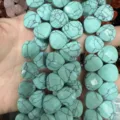 Close-up view of turquoise-colored facet-cut teardrop stone beads for DIY jewelry making - Heart / 13x13x6mm (Approx 27 Pcs/Strand) / Turquoise