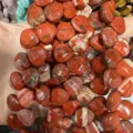 Close-up detail of natural faceted red jasper heart-shaped beads for DIY jewelry making - Heart / 13x13x6mm (Approx 27 Pcs/Strand) / Red Jasper