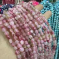 Close-up of 6mm faceted disc natural stone beads for DIY jewelry making - Two-Tone Jade