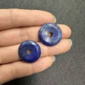 Macro detail of 20mm natural blue lapis lazuli stone donut beads for DIY jewelry making - 10 Pieces/Pack / Natural Lapis Lazuli