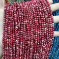 Macro detail of red imperial jasper round beads with natural white marble patterns - 4mm (Approx 90 Beads Per Strand) / Red