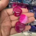 Close-up of 25mm pink banded natural agate heart-shaped gemstone pendants - 25*6mm / Rose Red Agate