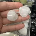Detailed view of 25mm natural heart-shaped white quartz crystal pendant with silver-tone bail - 25*6mm / White Jade