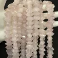 Close-up detail of natural pink stone hexagonal column beads for DIY jewelry making - 7x14mm (Approx. 24 Pieces/Strand) / Rose Quartz
