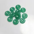 Detailed macro view of 15mm natural green stone donut beads for DIY jewelry making - 15mm / Green Aventurine