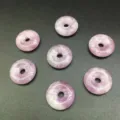 Detailed macro view of natural purple stone amethyst donut beads for jewelry making projects - 15mm / Lilac
